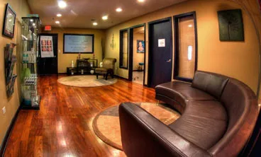 A comforting waiting room with nice lighting and plenty of seating